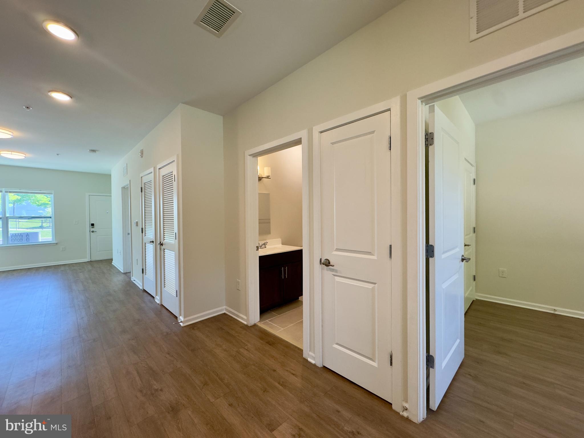 5608 Bucknell Road, Unit A Baltimore, MD 21206 - Photo 3 of 13 a view of a hallway with wooden floor