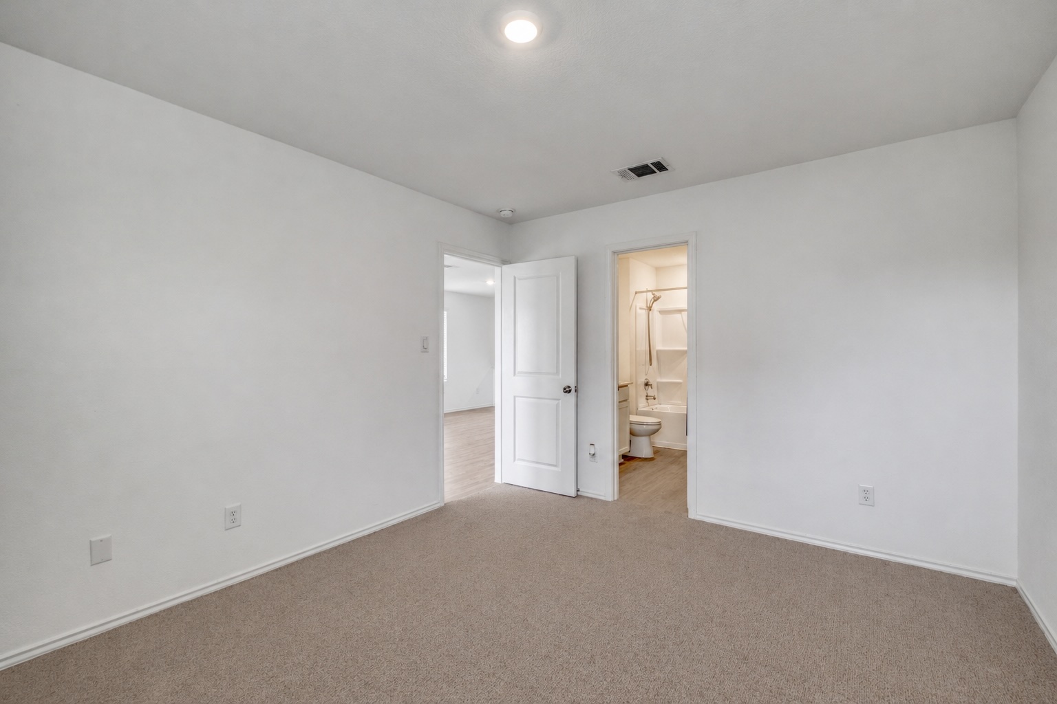 23412 Tiny Moons Way Elgin, TX 78621 - Photo 23 of 38 Spacious room featuring carpeting, white walls, and a recessed ceiling light
