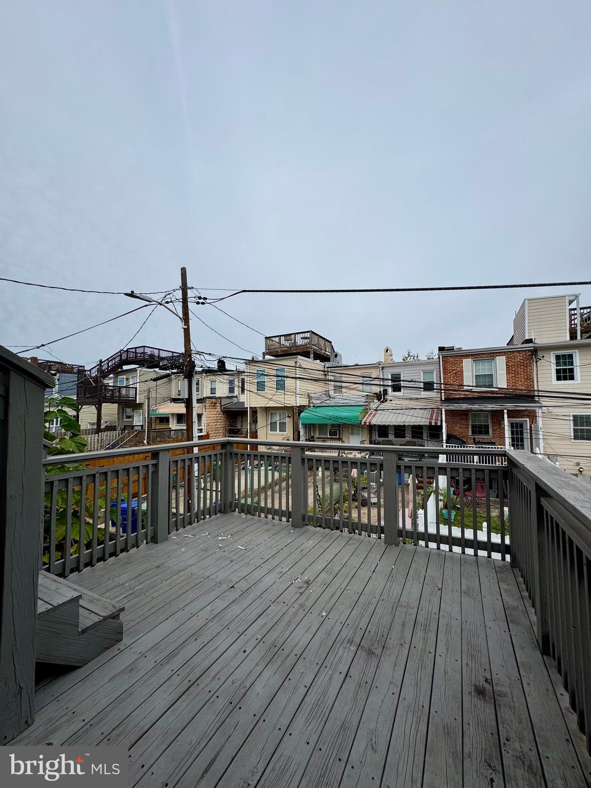 329 South Bouldin Street Baltimore, MD 21224 - Photo 27 of 36 a balcony with wooden floor