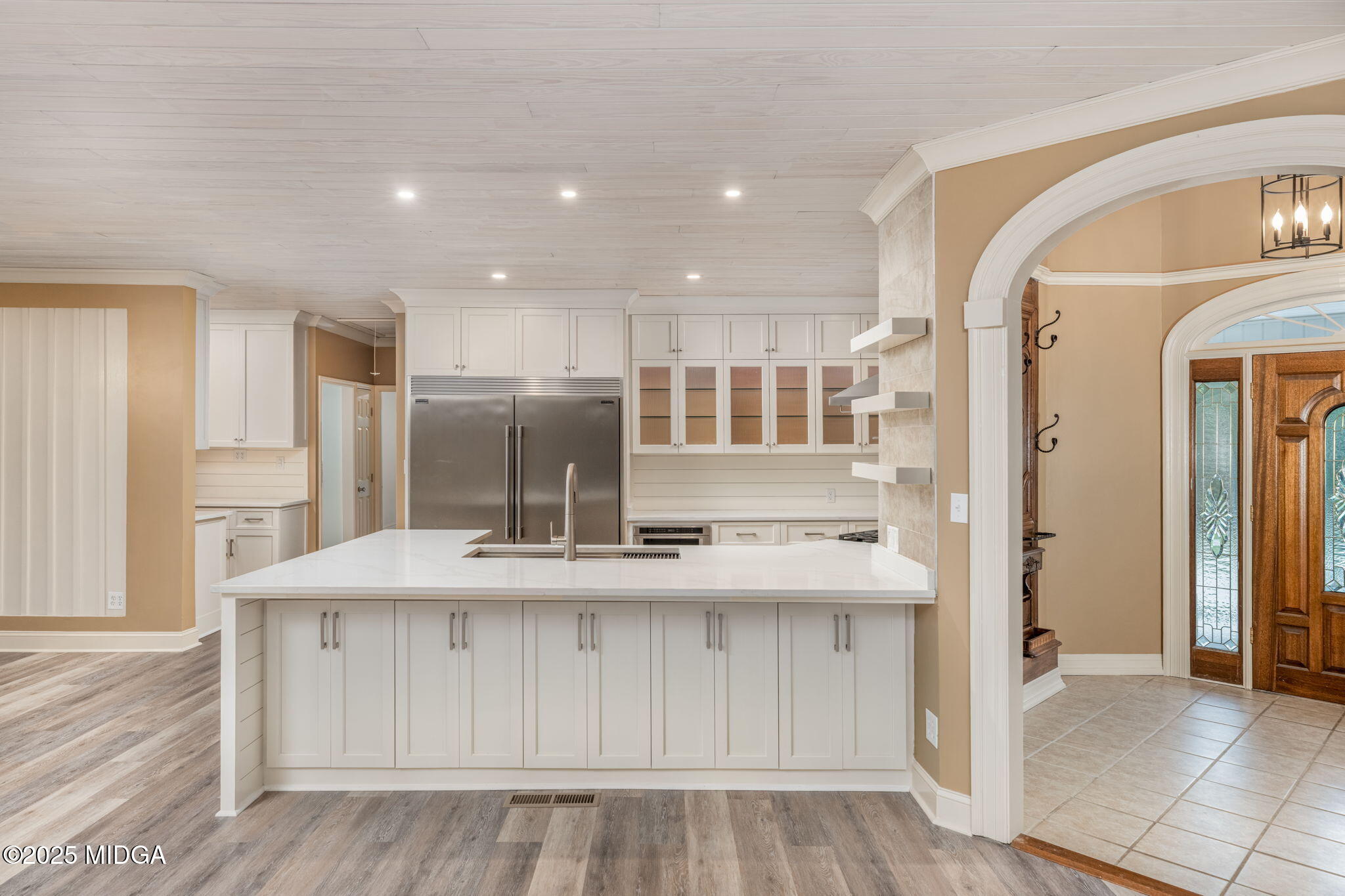 7335 Colaparchee Road Macon, GA 31220 - Photo 13 of 49 a view of kitchen with kitchen island wooden cabinets and refrigerator