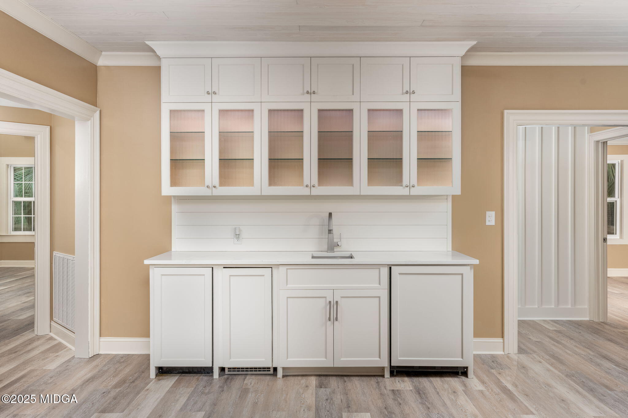 7335 Colaparchee Road Macon, GA 31220 - Photo 19 of 49 a kitchen with white cabinets and sink