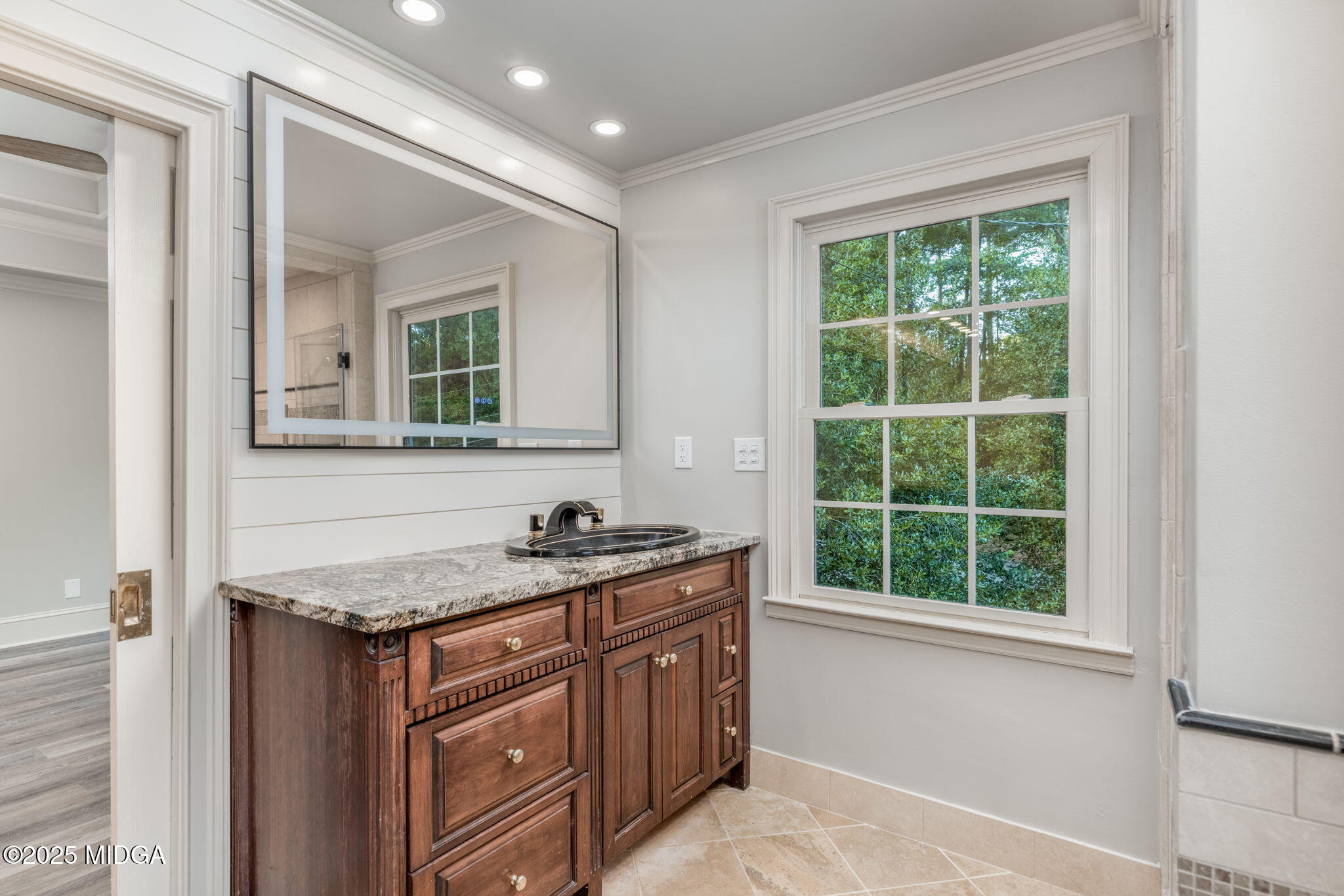 7335 Colaparchee Road Macon, GA 31220 - Photo 26 of 49 a bathroom with a granite countertop sink and a window