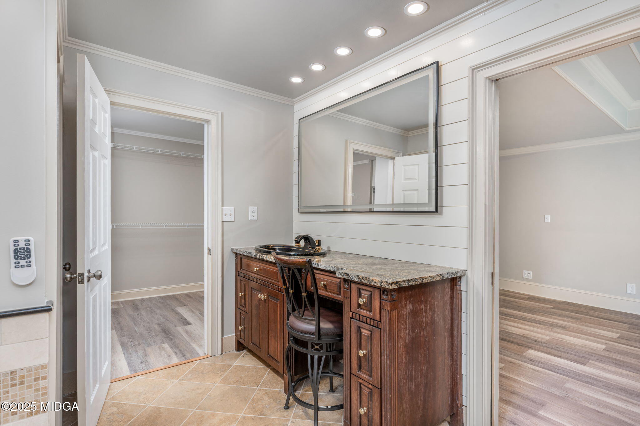 7335 Colaparchee Road Macon, GA 31220 - Photo 28 of 49 a bathroom with a granite countertop sink a mirror and a shower
