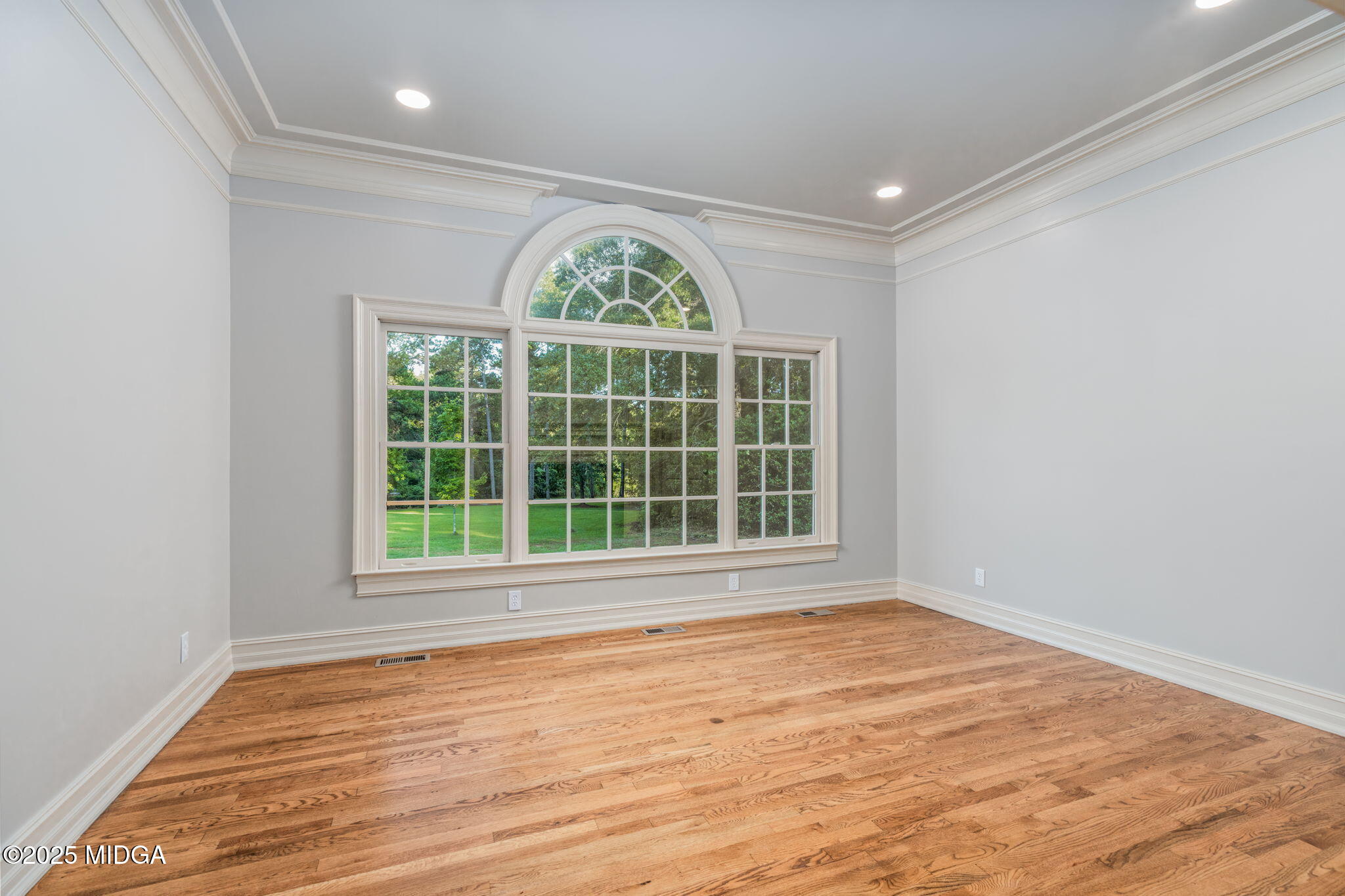 7335 Colaparchee Road Macon, GA 31220 - Photo 31 of 49 an empty room with wooden floor and a window