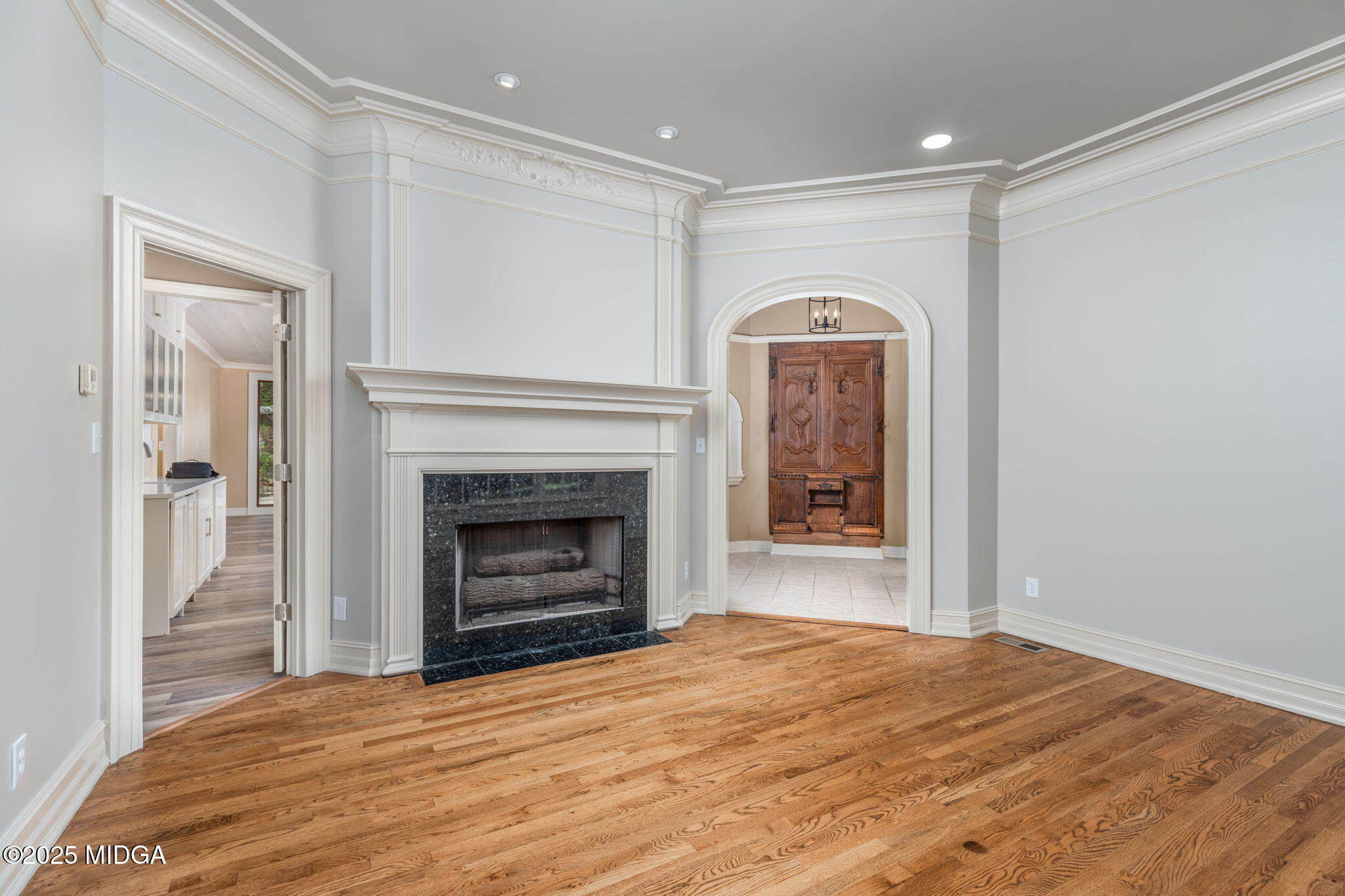 7335 Colaparchee Road Macon, GA 31220 - Photo 32 of 49 a view of an empty room with a fireplace and a window