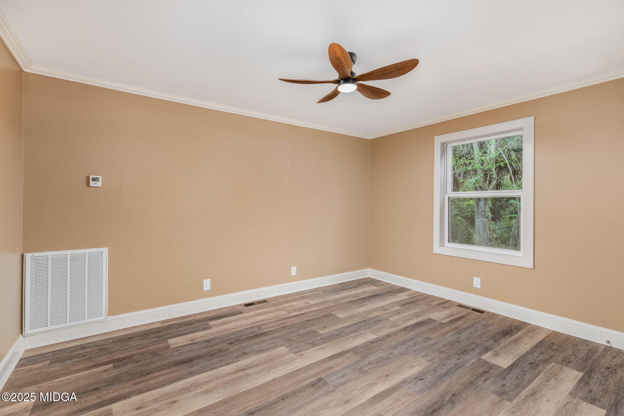 7335 Colaparchee Road Macon, GA 31220 - Photo 36 of 49 a view of empty room with wooden floor and fan