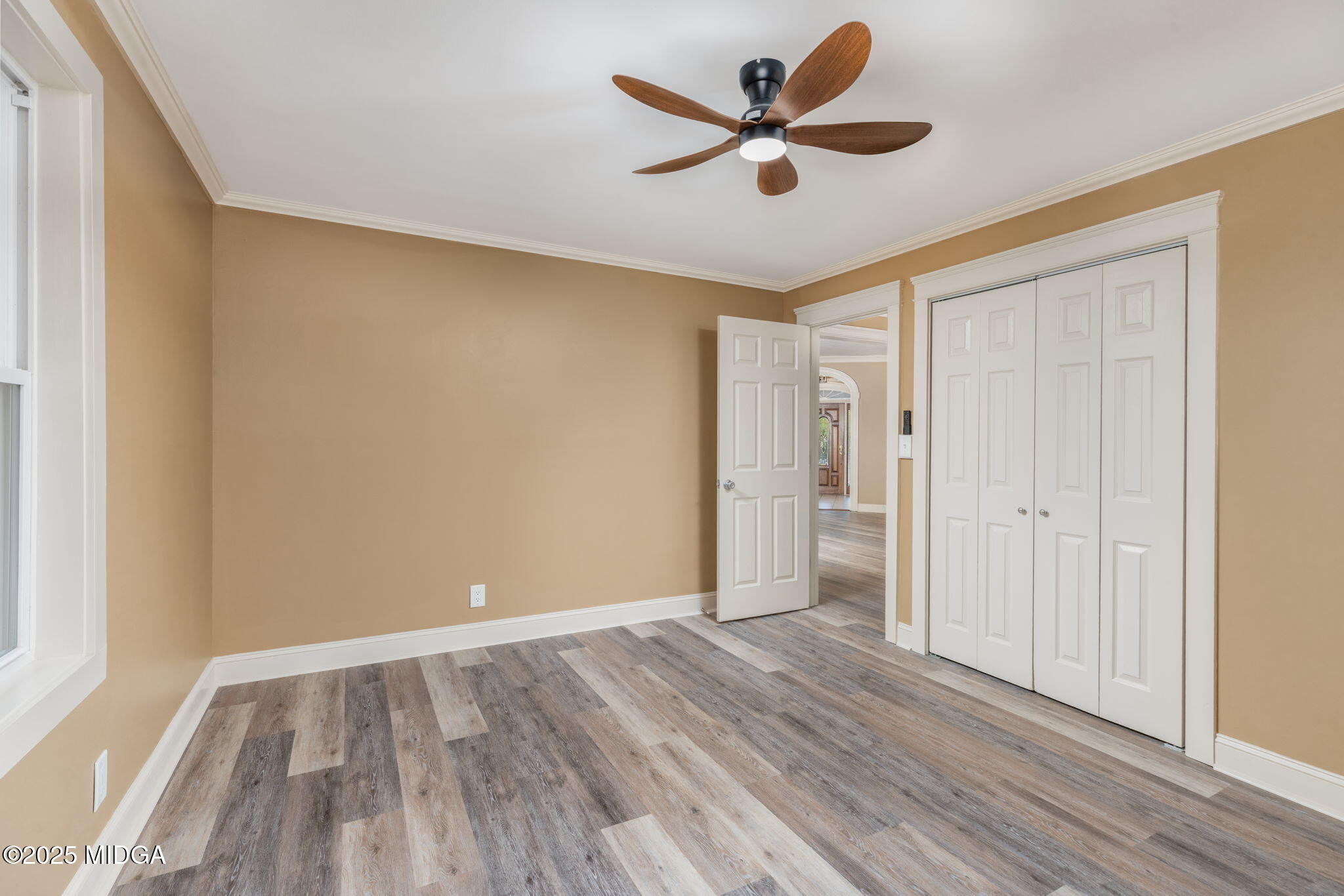7335 Colaparchee Road Macon, GA 31220 - Photo 37 of 49 an empty room with wooden floor and windows