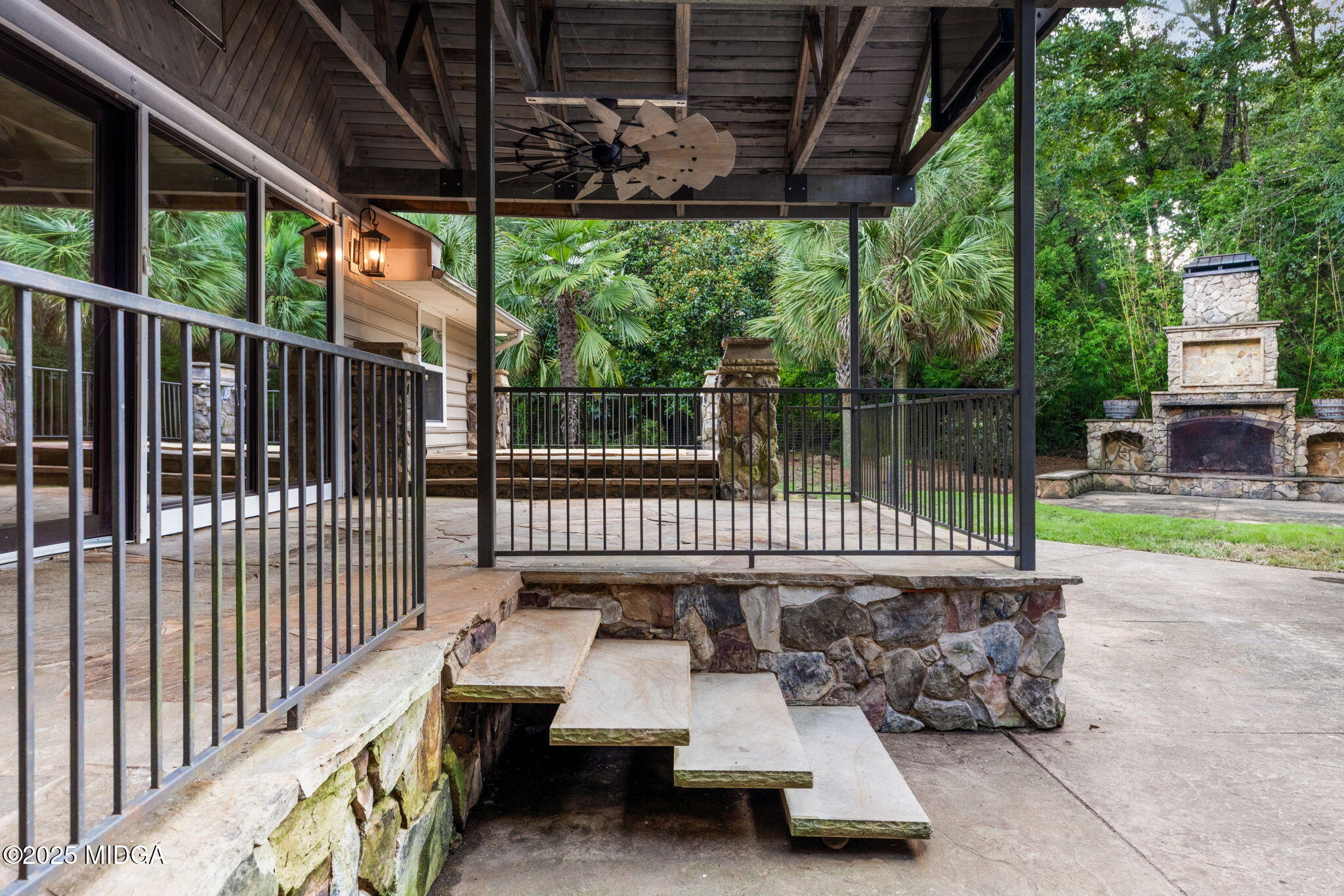 7335 Colaparchee Road Macon, GA 31220 - Photo 47 of 49 a roof deck with table and chairs and wooden fence