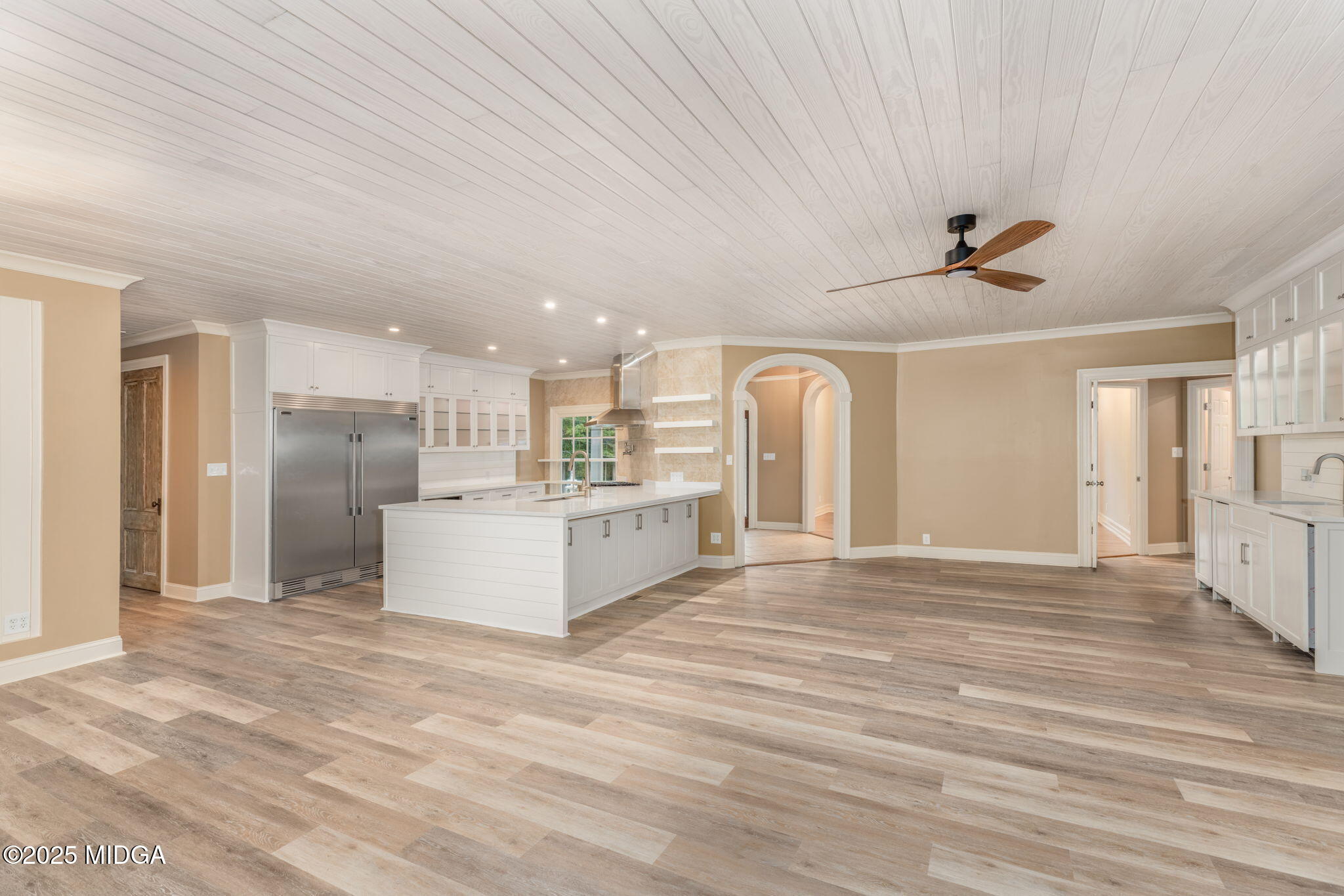 7335 Colaparchee Road Macon, GA 31220 - Photo 7 of 49 a view of kitchen and empty room with wooden floor