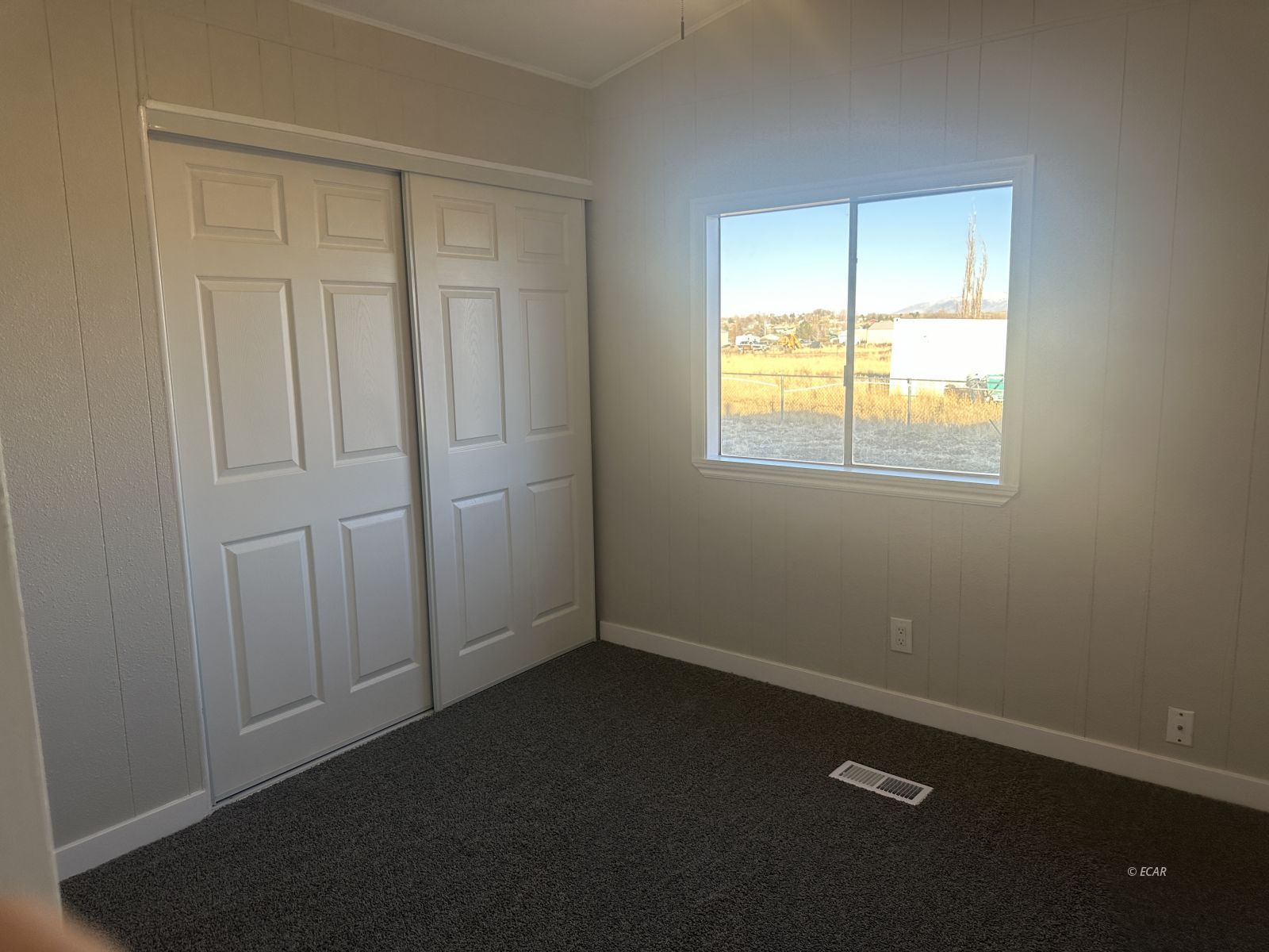 940 Spring Valley Parkway Spring Creek, NV 89815 - Photo 12 of 25 an empty room with a window