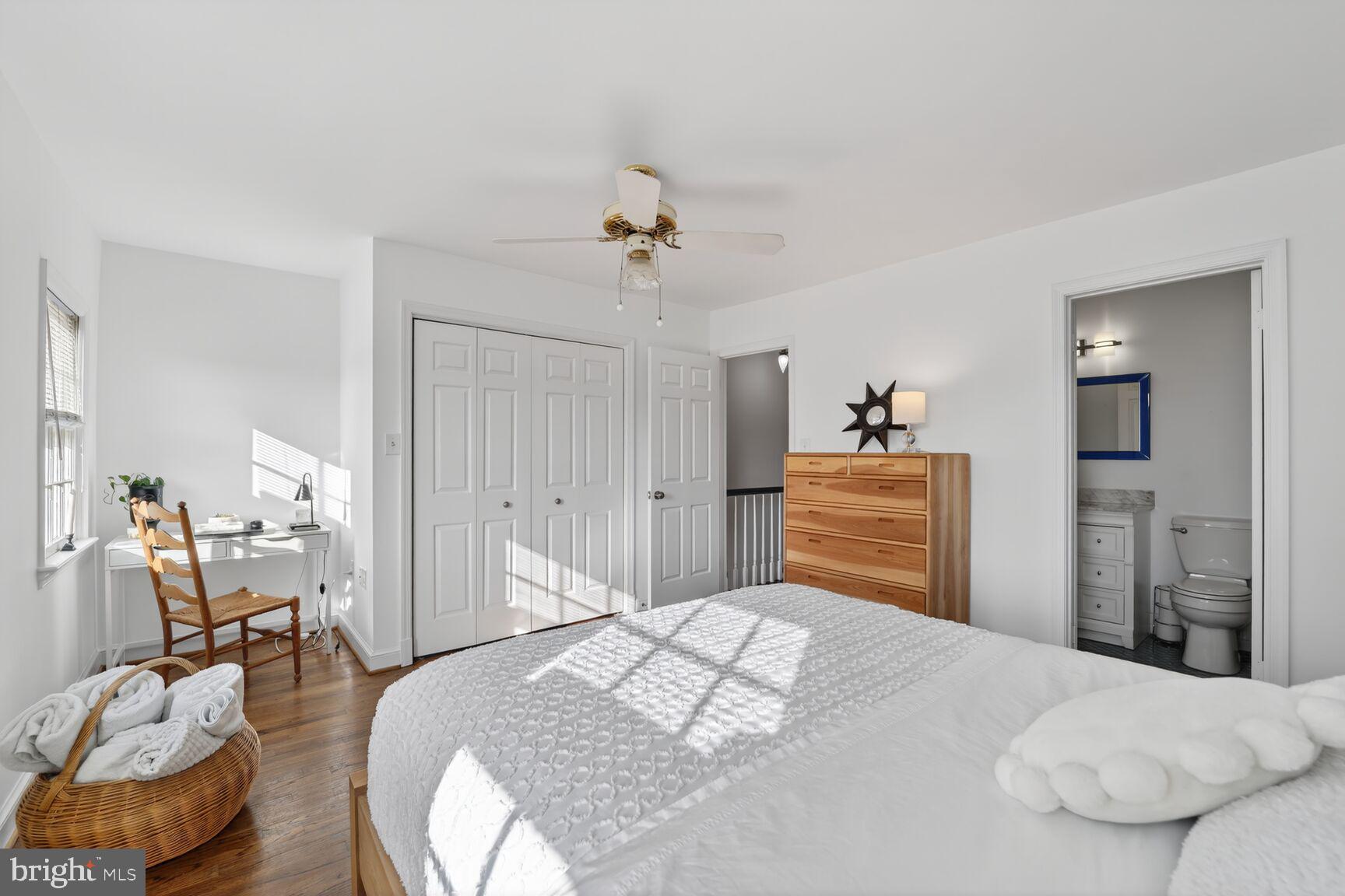 203 Princess Street Alexandria, VA 22314 - Photo 16 of 30 a bedroom with a bed and a chandelier