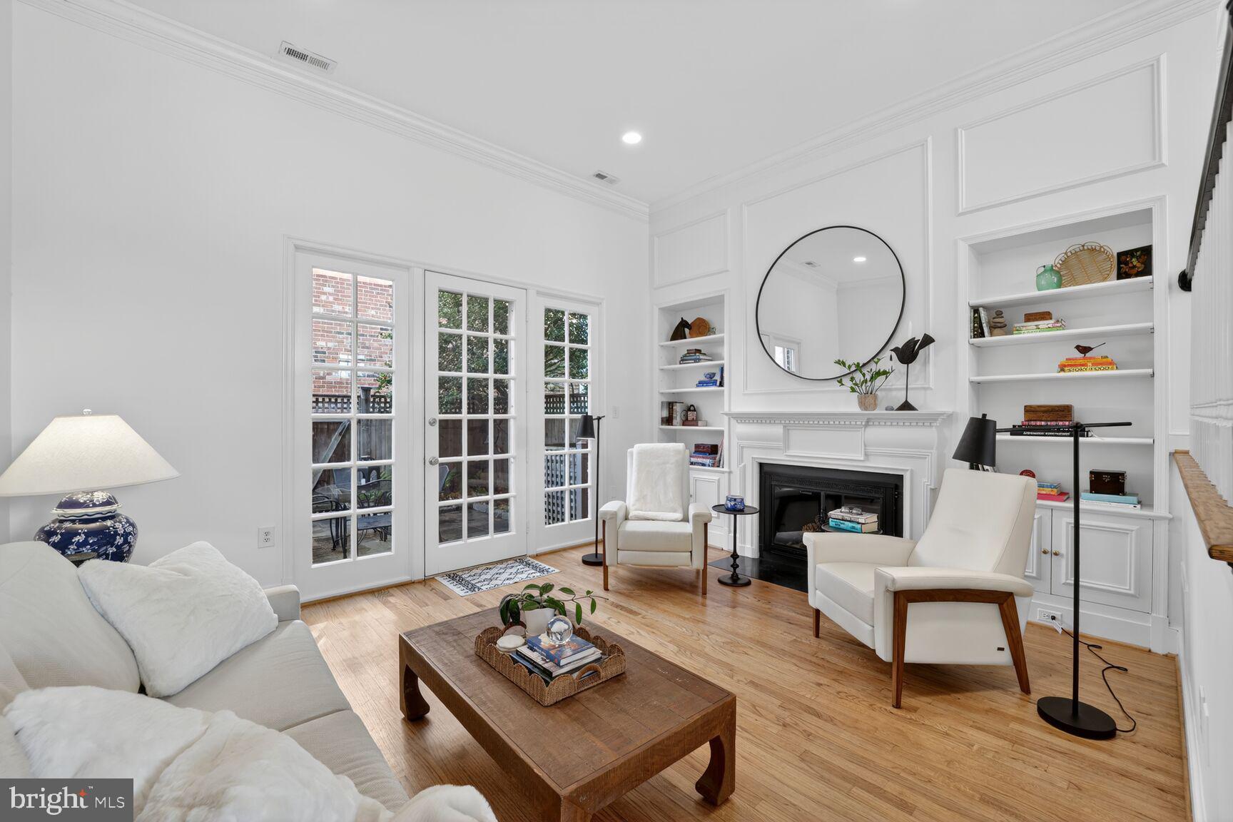 203 Princess Street Alexandria, VA 22314 - Photo 3 of 30 a living room with furniture and a fireplace