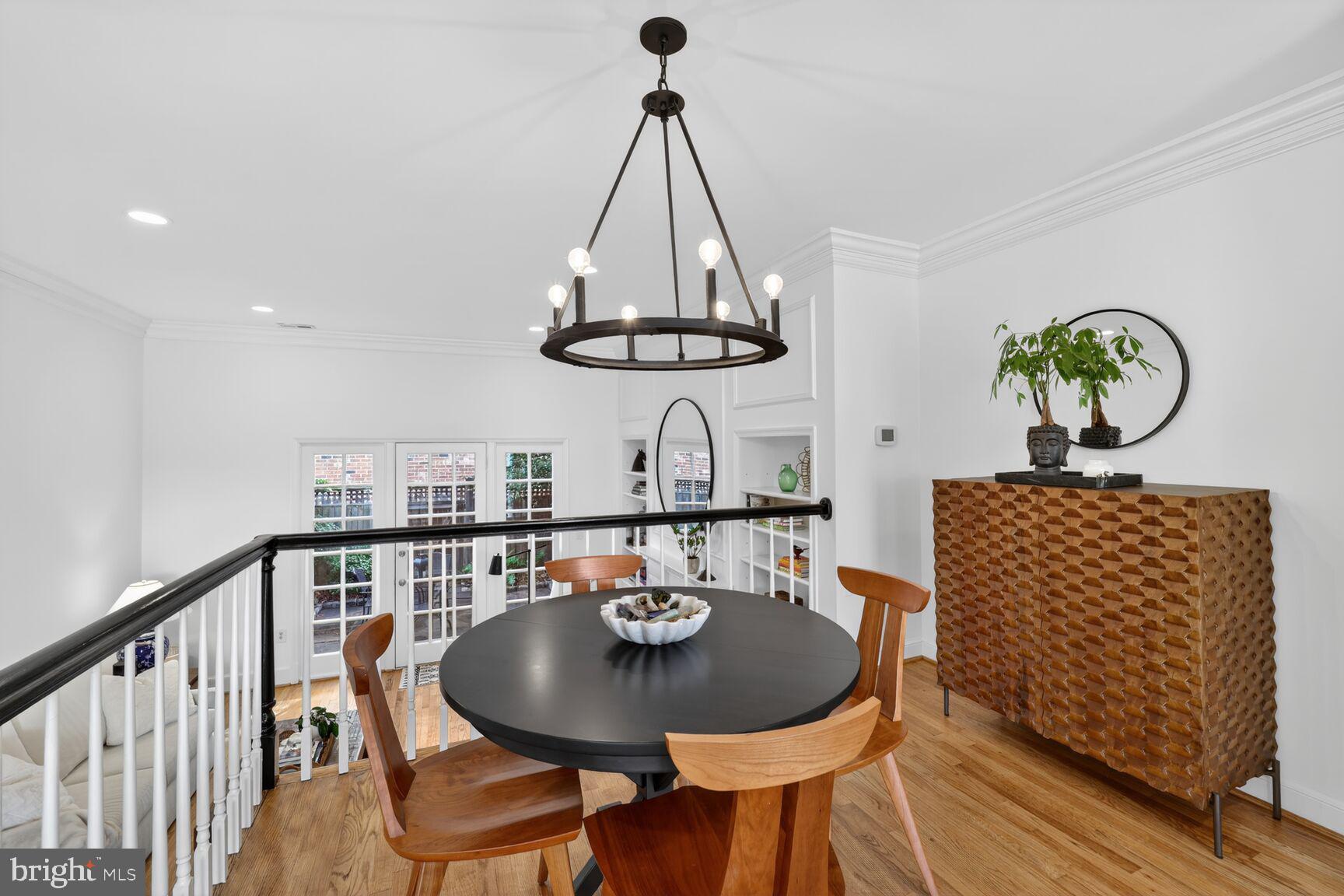 203 Princess Street Alexandria, VA 22314 - Photo 8 of 30 a dining room with furniture a rug and wooden floor