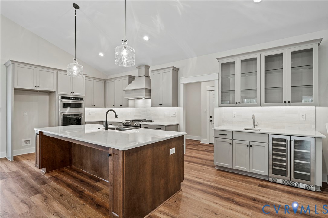 4-2 Old Telegraph Road Providence Forge, VA 23140 - Photo 7 of 32 a kitchen with kitchen island a sink stainless steel appliances and cabinets
