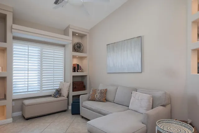 a view of a livingroom with furniture and a flat screen tv