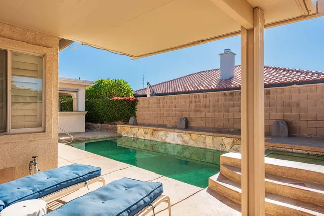 a view of house with outdoor space and seating