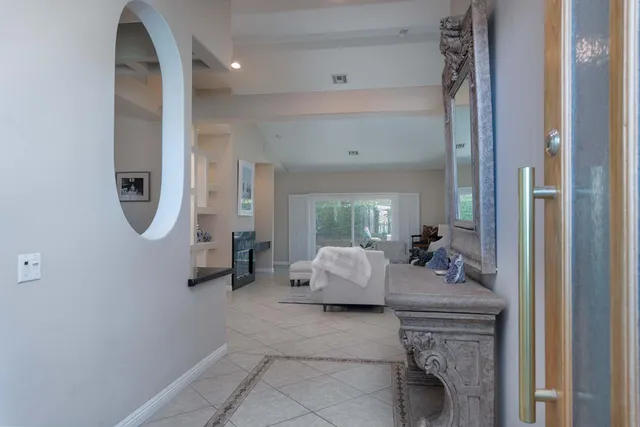a room with a table and a potted plant