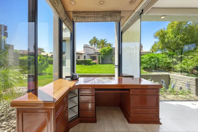 a front view of a house with flowers