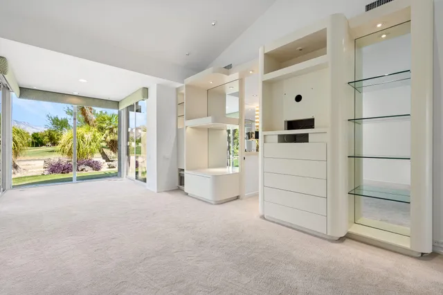 a room with furniture and a flat screen tv