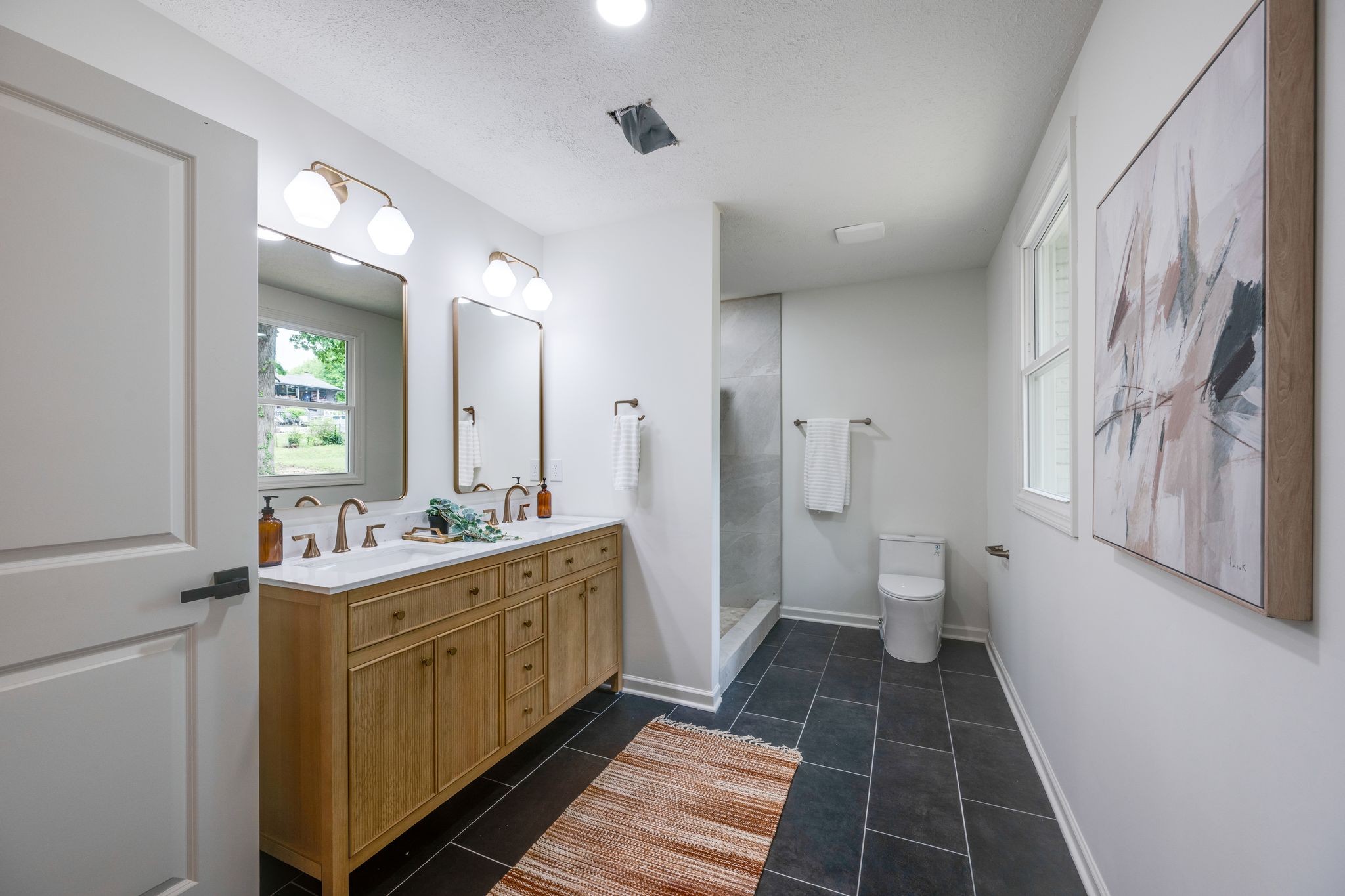 312 Bluebird Lane Dickson, TN 37055 - Photo 13 of 25 a bathroom with a sink a toilet and a mirror