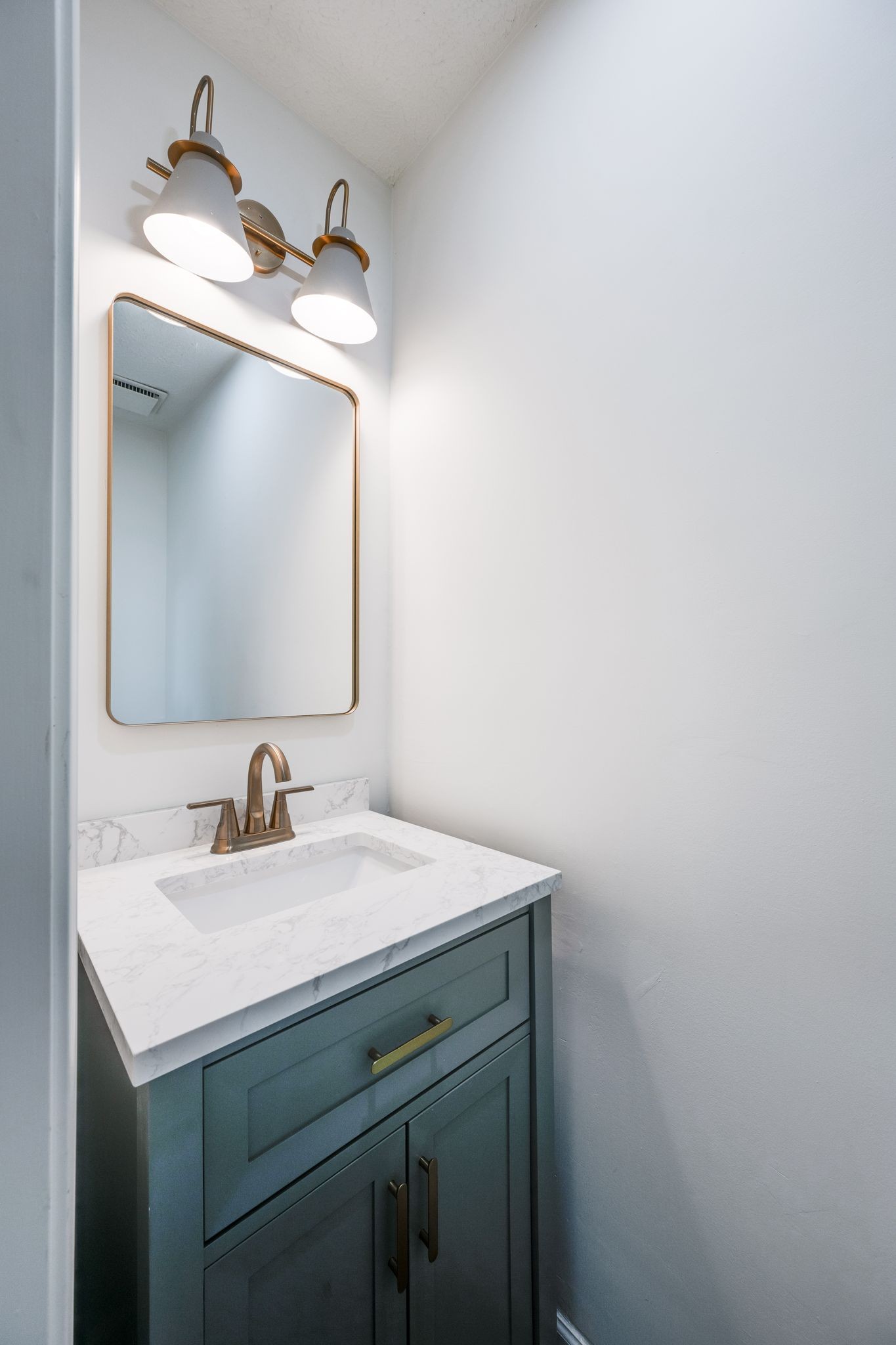 312 Bluebird Lane Dickson, TN 37055 - Photo 17 of 25 a bathroom with a sink and a mirror
