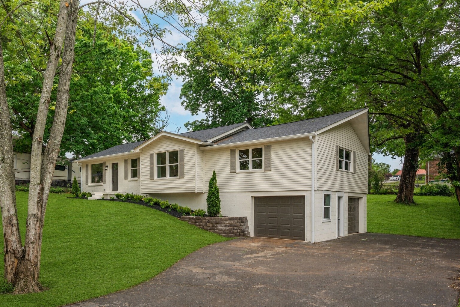 312 Bluebird Lane Dickson, TN 37055 - Photo 2 of 25 a front view of house with yard and green space
