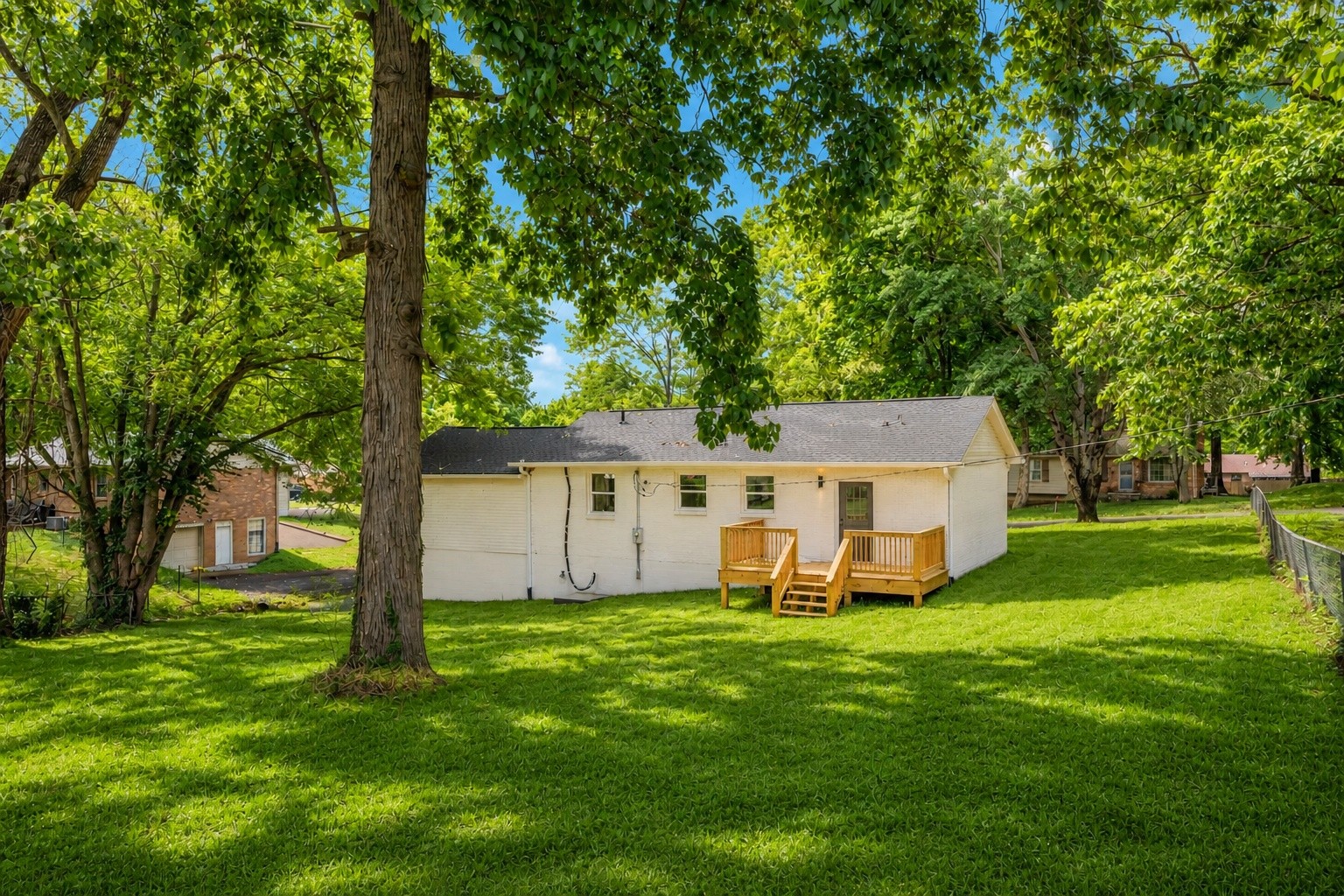 312 Bluebird Lane Dickson, TN 37055 - Photo 21 of 25 a view of a house with backyard and a tree