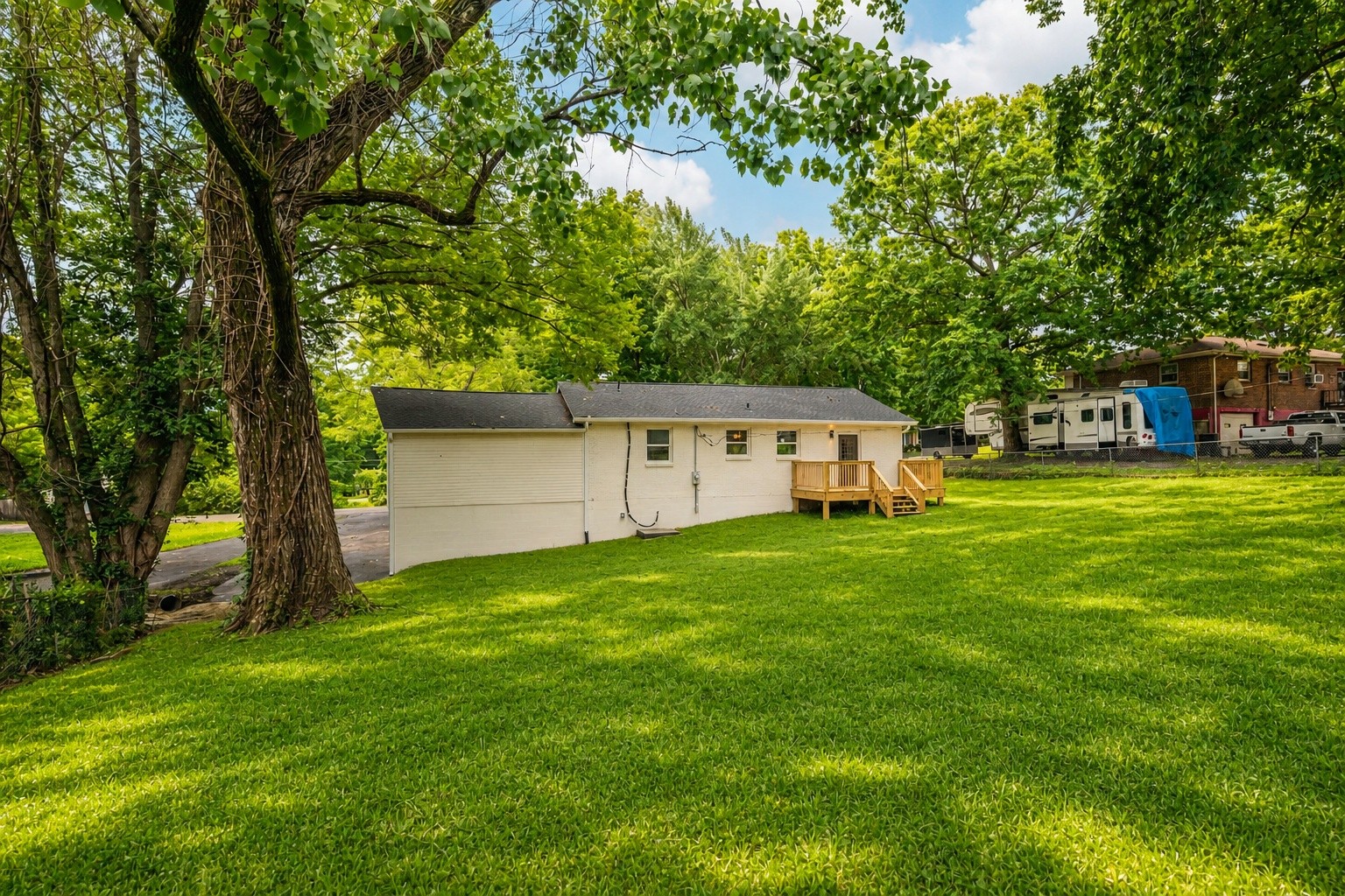 312 Bluebird Lane Dickson, TN 37055 - Photo 22 of 25 a view of a house with a big yard and large trees