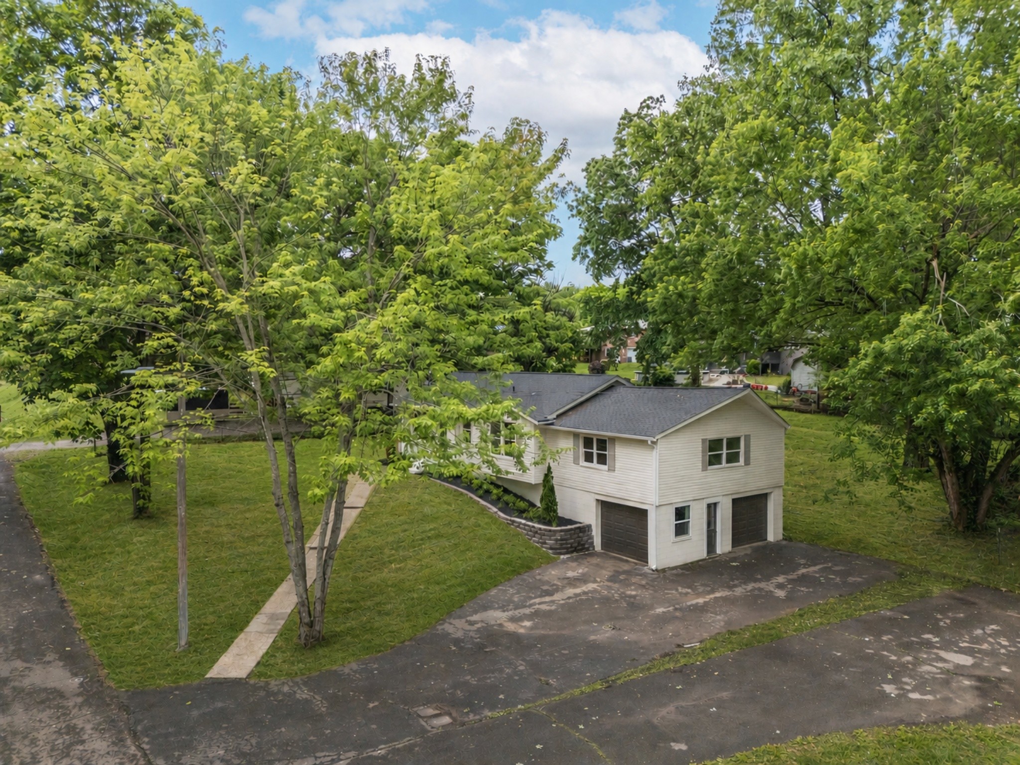 312 Bluebird Lane Dickson, TN 37055 - Photo 23 of 25 a house with trees in the background