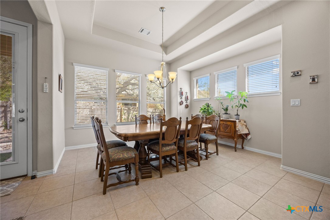 1205 Winding Way Drive Georgetown, TX 78628 - Photo 27 of 39 Dining area is attached to the kitchen and has large windows allowing for natural light.