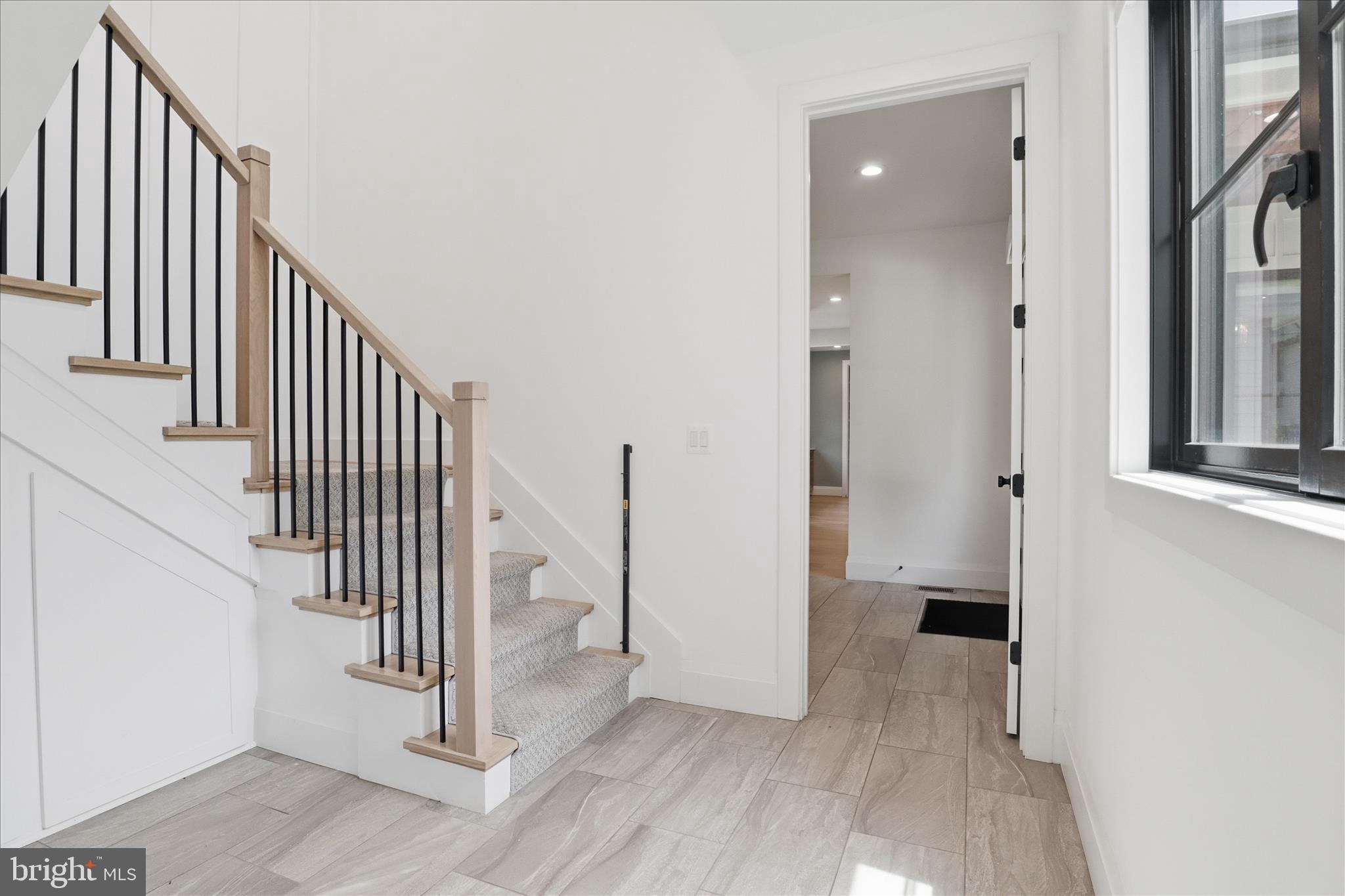 202 Branch Road Southeast Vienna, VA 22180 - Photo 25 of 59 an entryway of a house with wooden floor and entryway