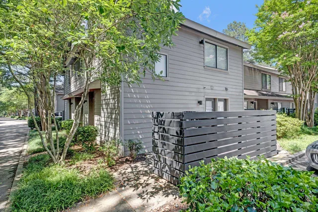 a view of a house with a small backyard