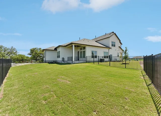 a front view of house with an outdoor space and seating