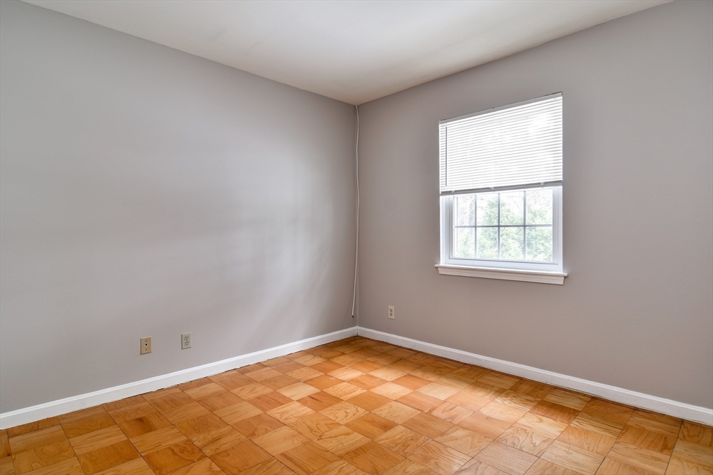 1907 Windsor Drive, Unit 1907 Framingham, MA 01701 - Photo 13 of 22 an empty room with a window
