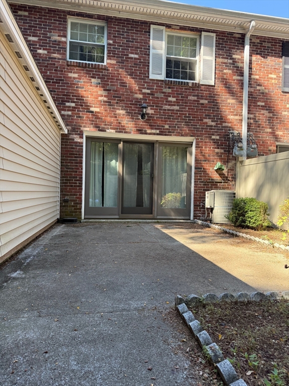 1907 Windsor Drive, Unit 1907 Framingham, MA 01701 - Photo 16 of 22 a view of a house with a yard and garage