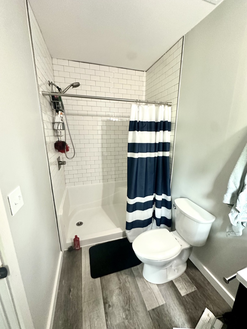 229 Broadway Street Tamaroa, IL 62888 - Photo 6 of 11 a bathroom with a sink a toilet a mirror and shower