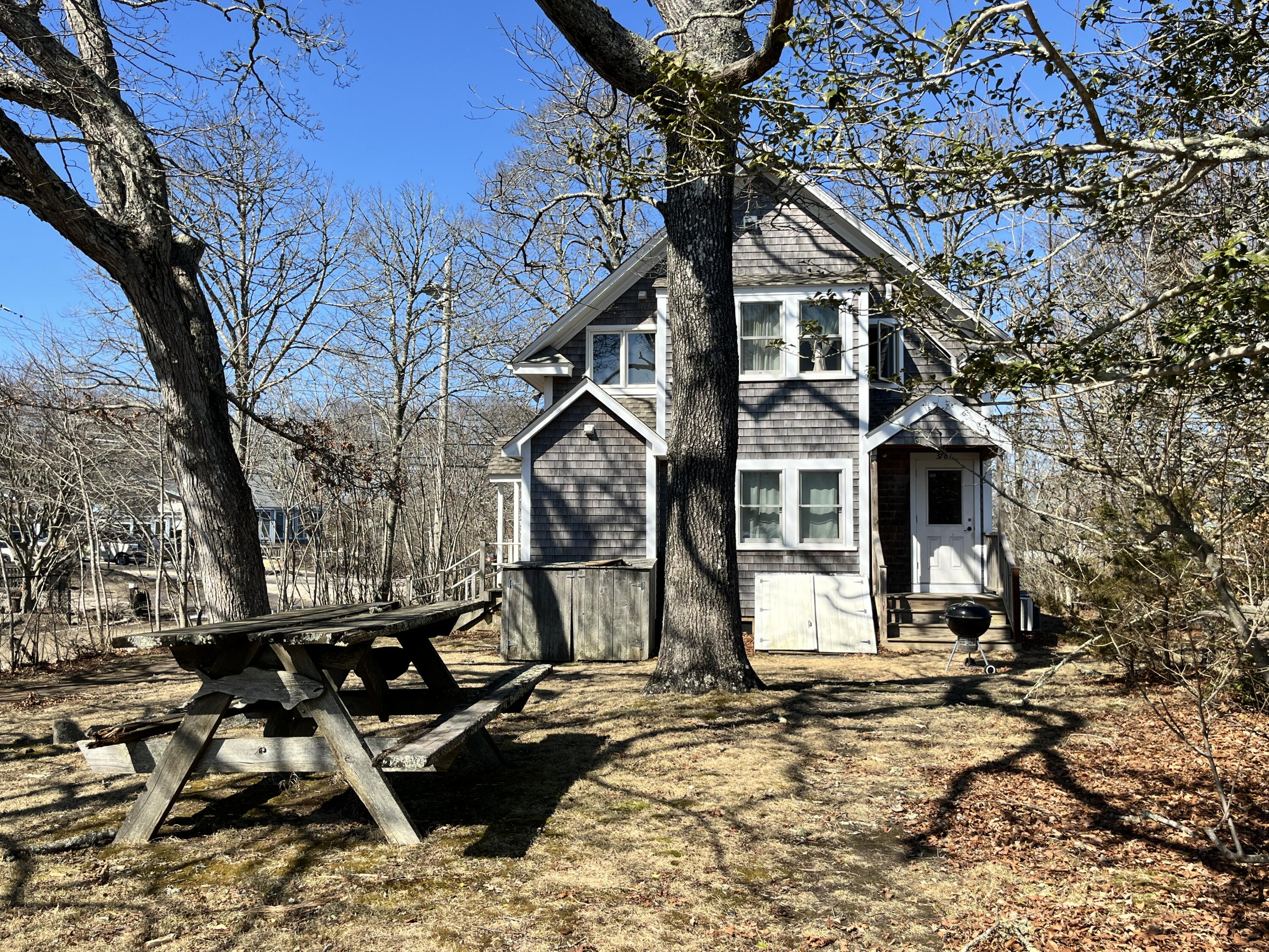 378 State Road Vineyard Haven, MA 02568 - Photo 12 of 23 a front view of a house with a yard