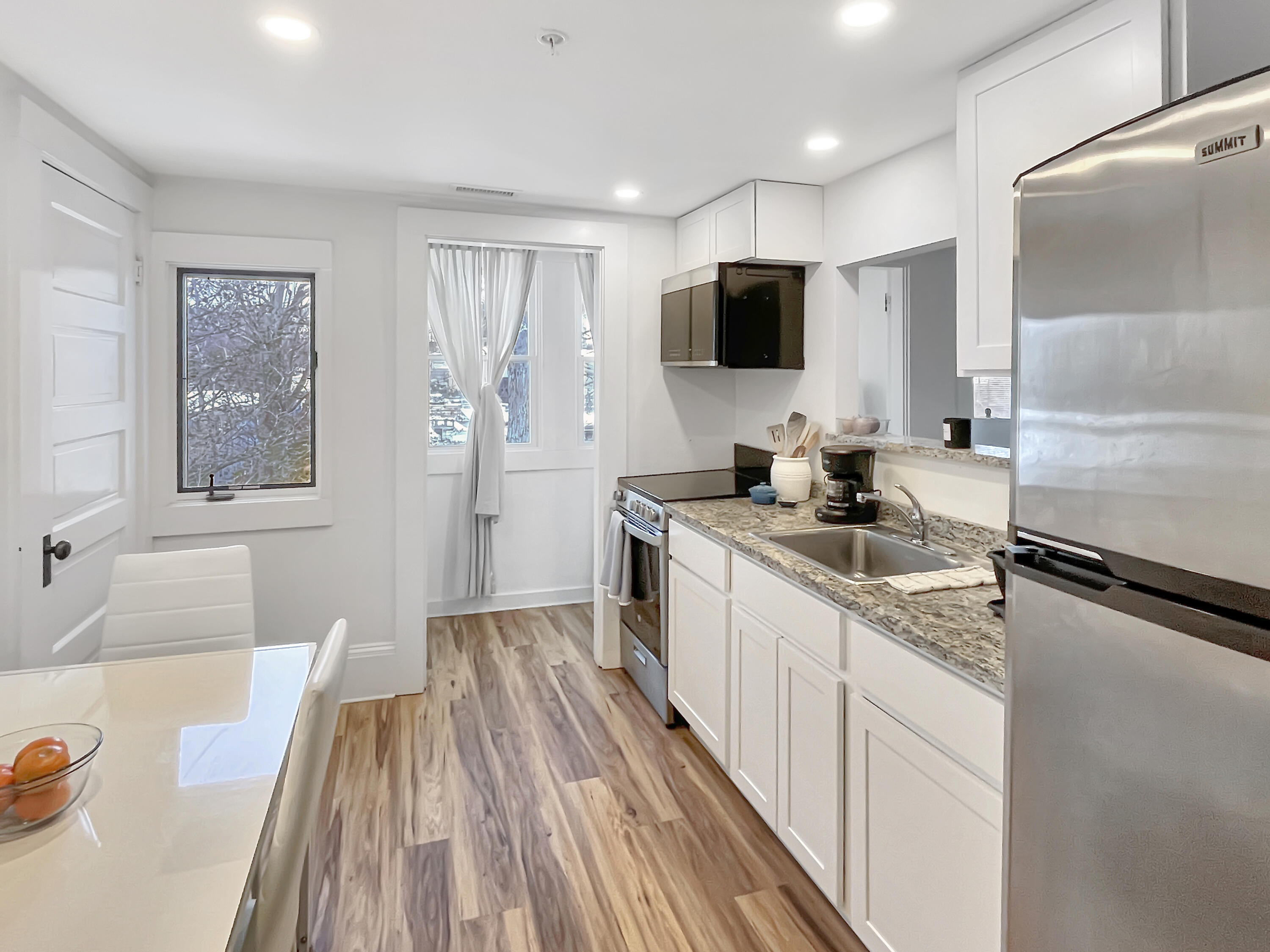 378 State Road Vineyard Haven, MA 02568 - Photo 13 of 23 a kitchen with a sink stove top oven and microwave