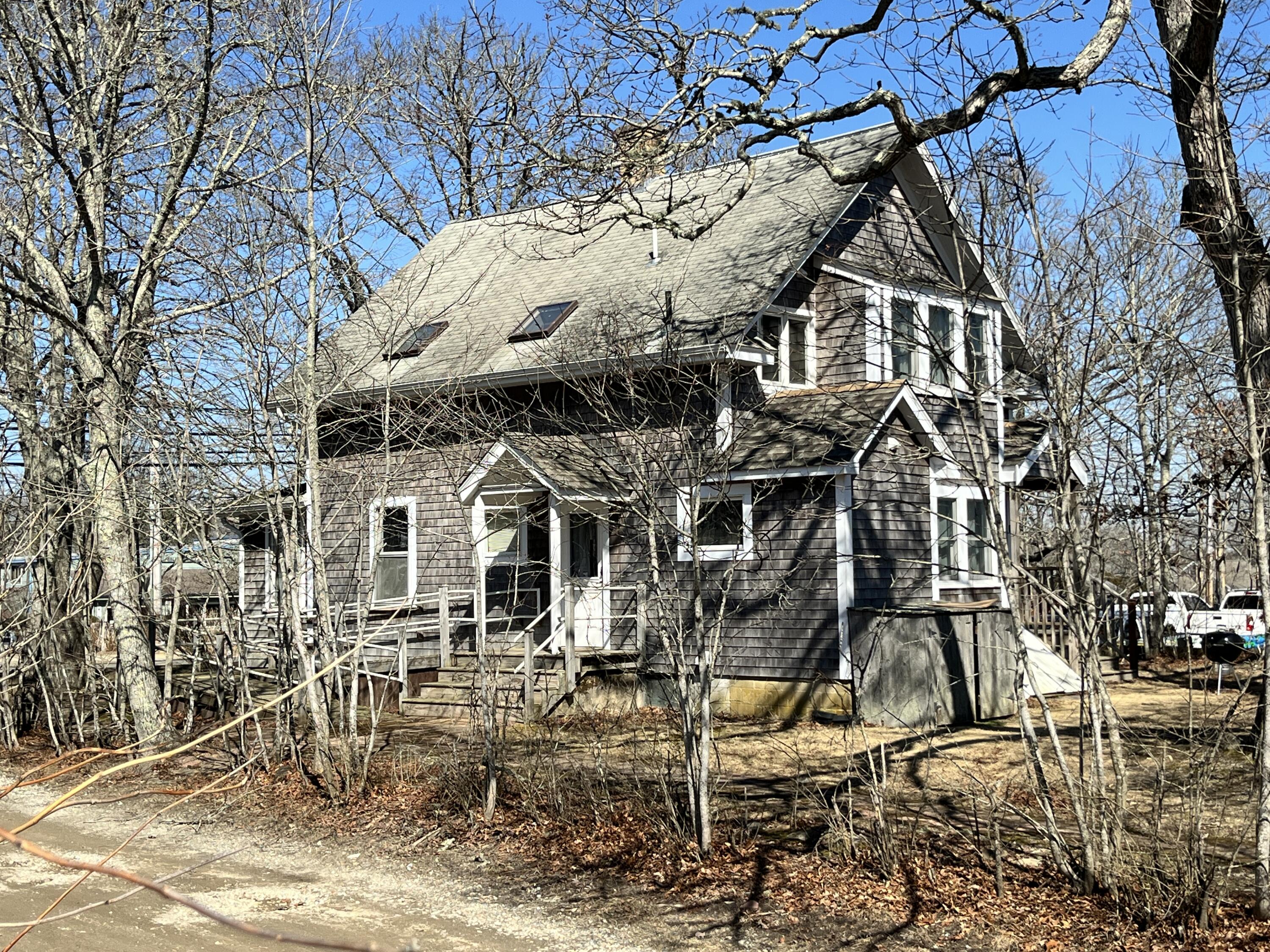 378 State Road Vineyard Haven, MA 02568 - Photo 2 of 23 front view of a building with a lot of trees