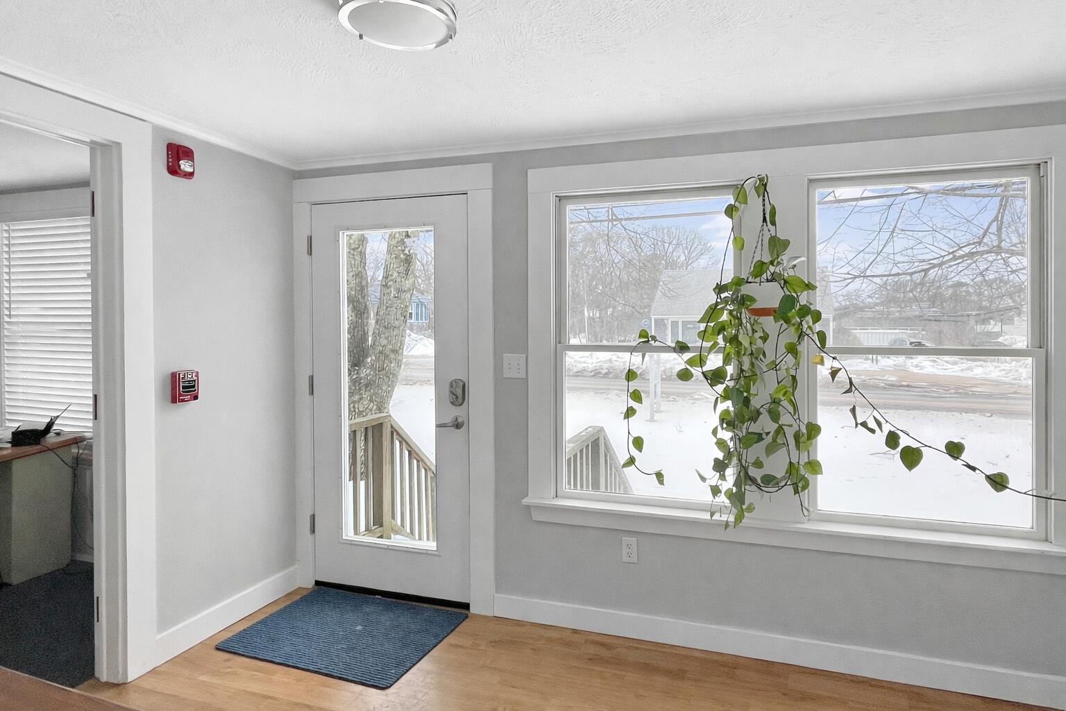 378 State Road Vineyard Haven, MA 02568 - Photo 4 of 23 a view of a room that has a window and wooden floor