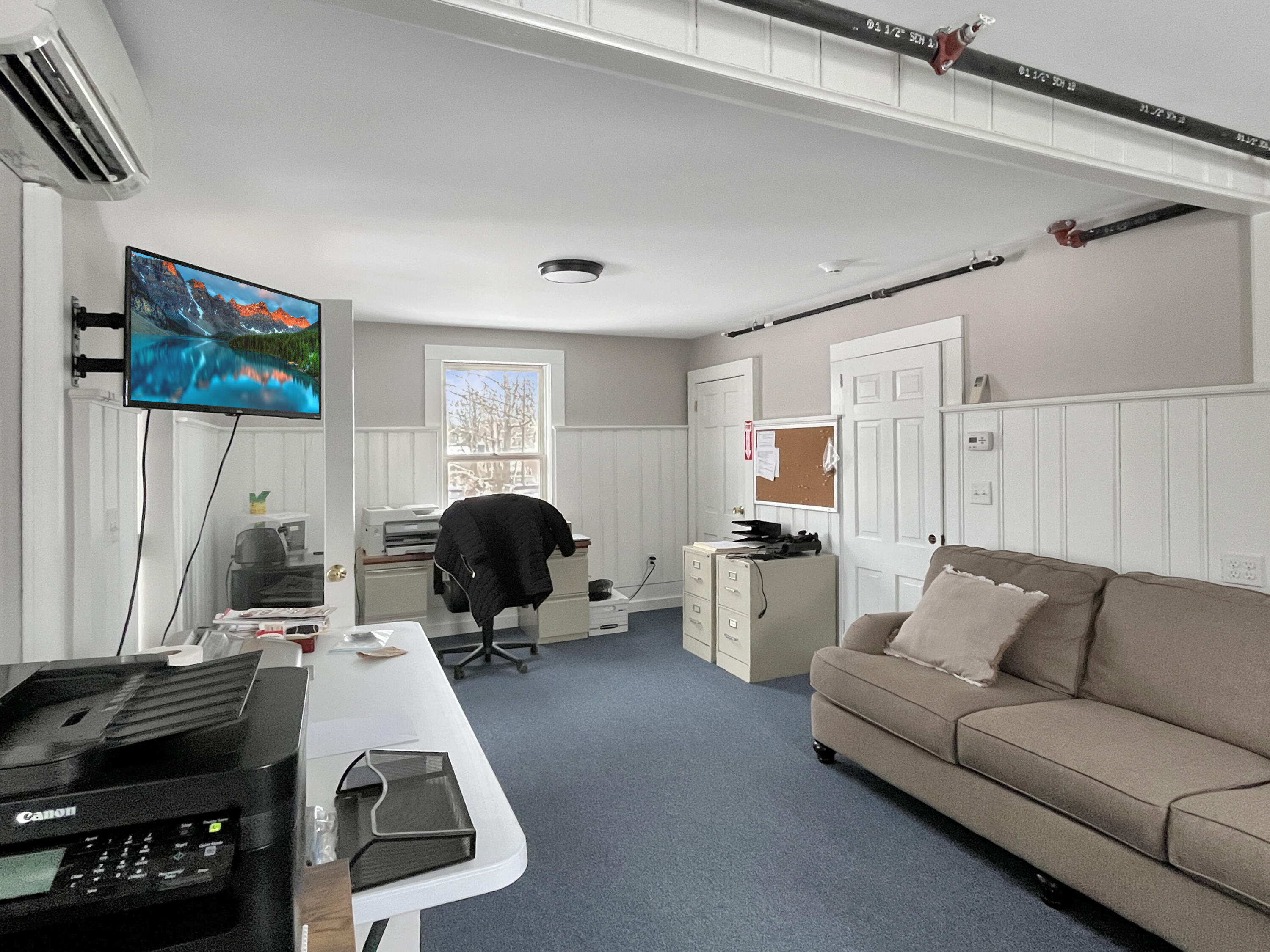 378 State Road Vineyard Haven, MA 02568 - Photo 9 of 23 a living room with furniture a window and gym equipment