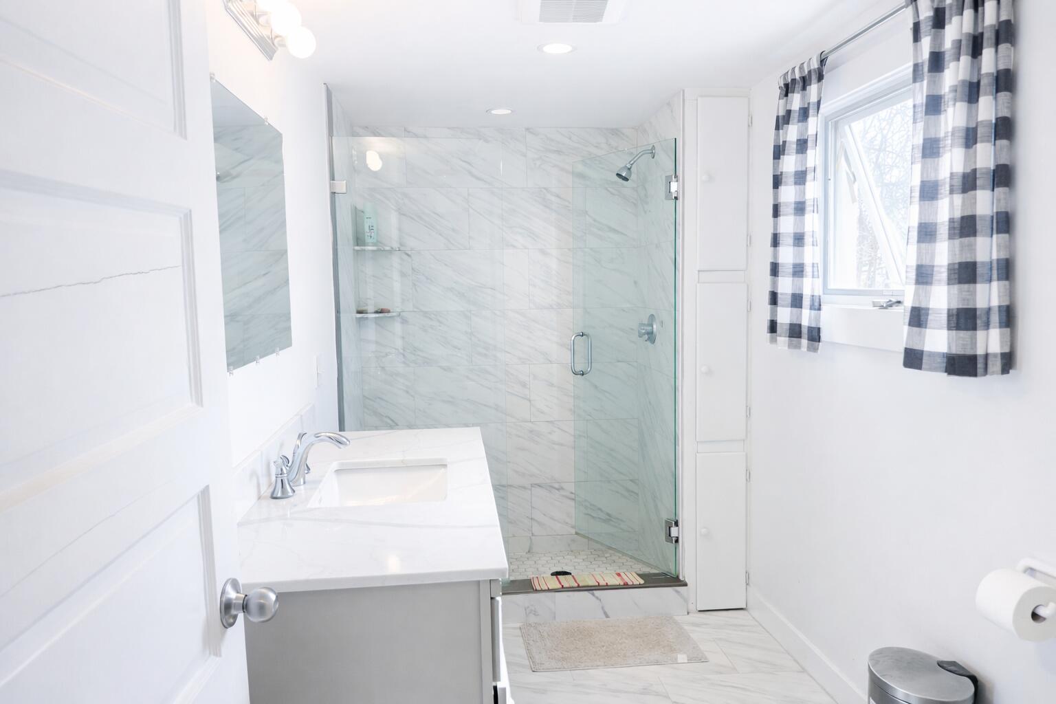 378 State Road Vineyard Haven, MA 02568 - Photo 10 of 23 a bathroom with a sink and a mirror