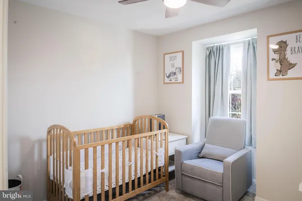 a white toilet sitting next to a shower