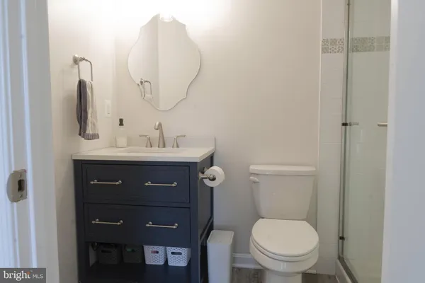 a view of a bathroom from a hallway