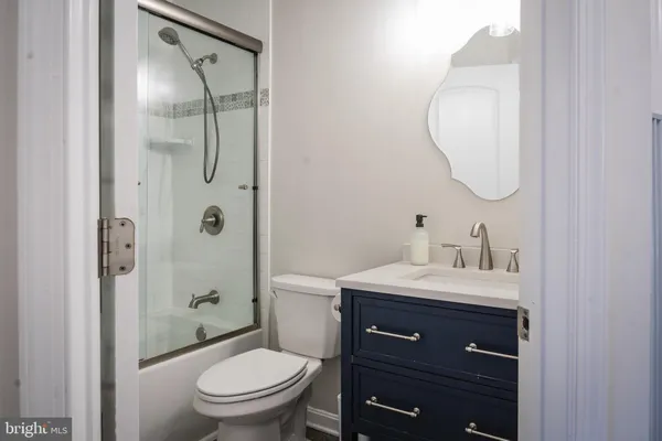 a view of a bathroom from a hallway