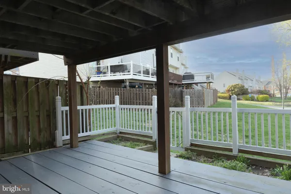 an aerial view of a house with outdoor seating