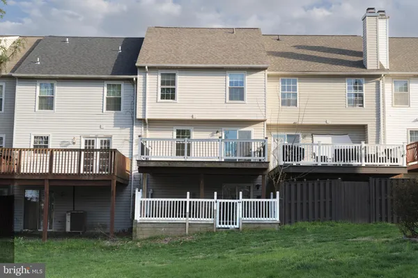 a view of a swimming pool with chairs in patio