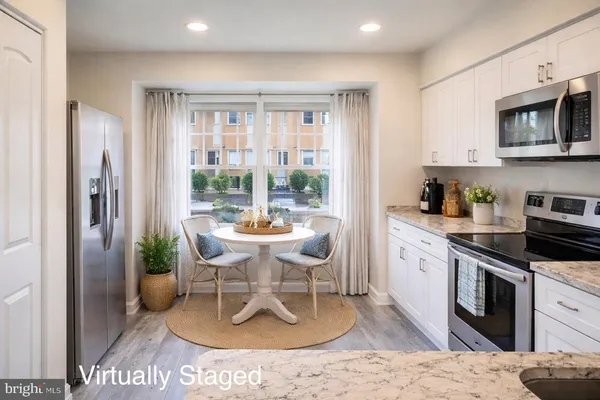 a view of a kitchen cabinets and wooden floor