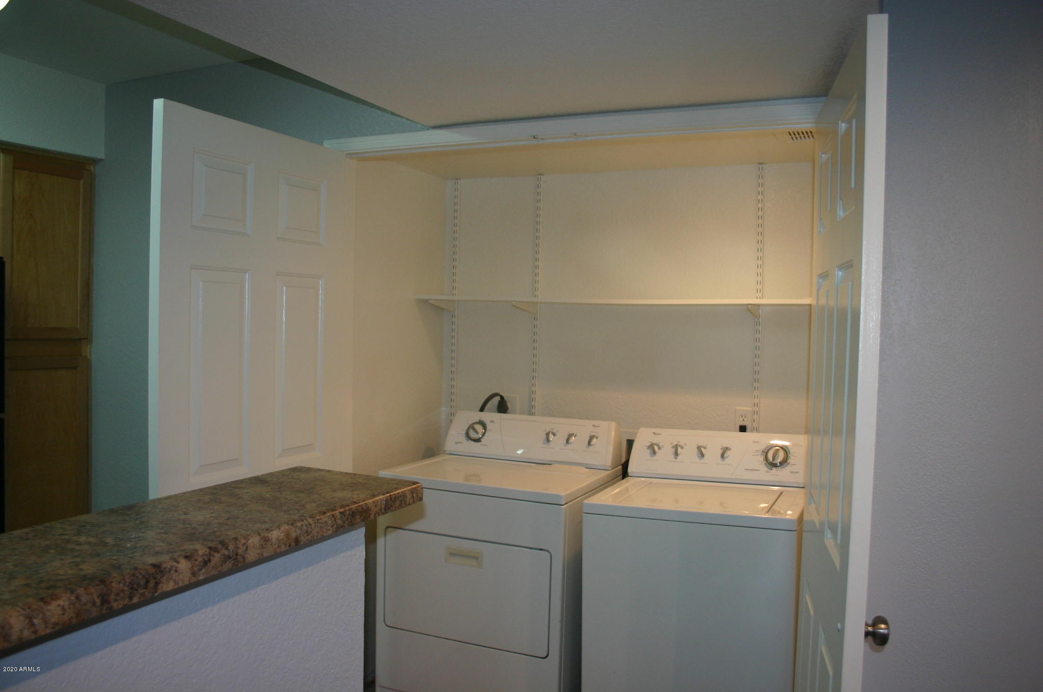 8787 East Mountain View Road, Unit 1014 Scottsdale, AZ 85258 - Photo 14 of 27 a utility room with dryer and washer