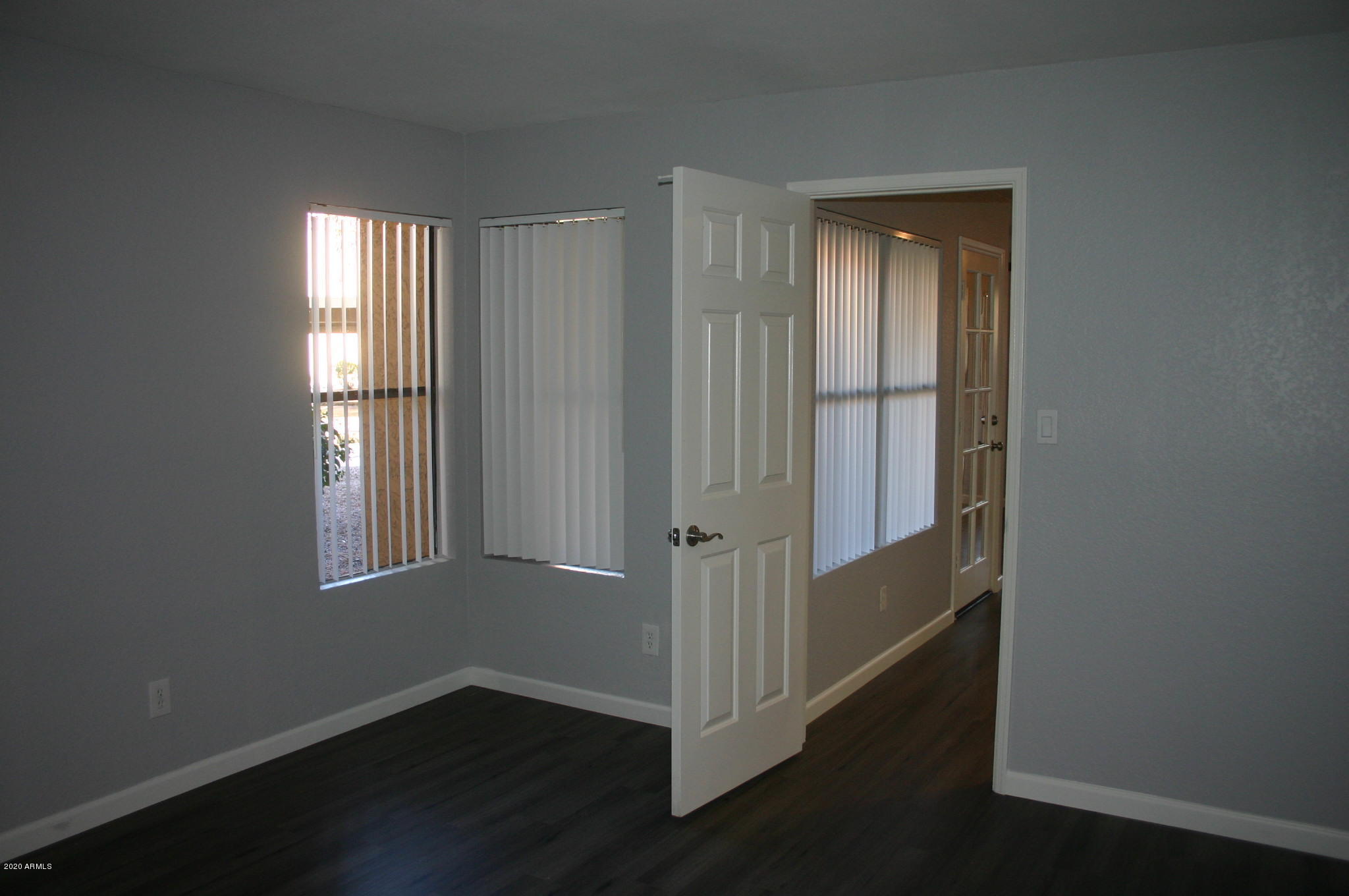 8787 East Mountain View Road, Unit 1014 Scottsdale, AZ 85258 - Photo 15 of 27 an entryway with a window and wooden floor